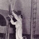 Angel Bojilov Sr performing a combination juggling trick on the slackwire