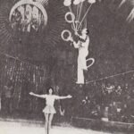 Angel Bojilov Sr performing a juggling combination trick while balanced on a slackwire with his daughter assisting him