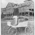 inventor stood on his car