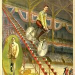 performer rides down staircase on bicycle