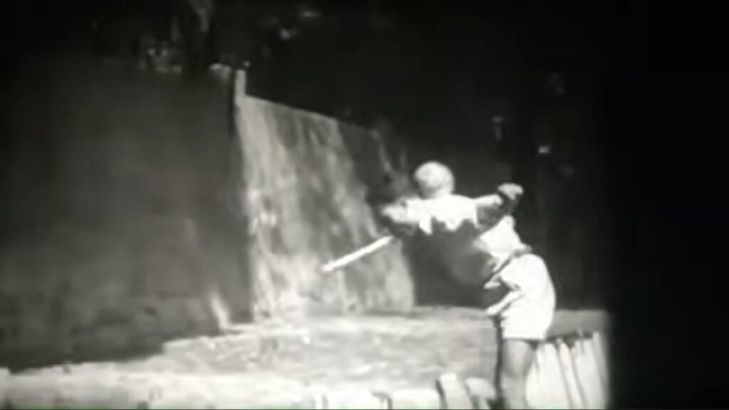 juggler with mouth stick and soccer ball neck catch